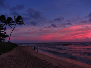 Beautiful purple and pink sunset on Poipu beach.