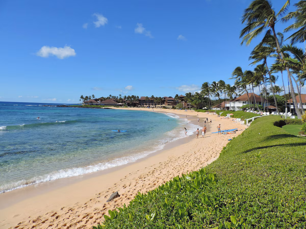Picture of Poipu Beach with Kiahuna Plantation to the right.
